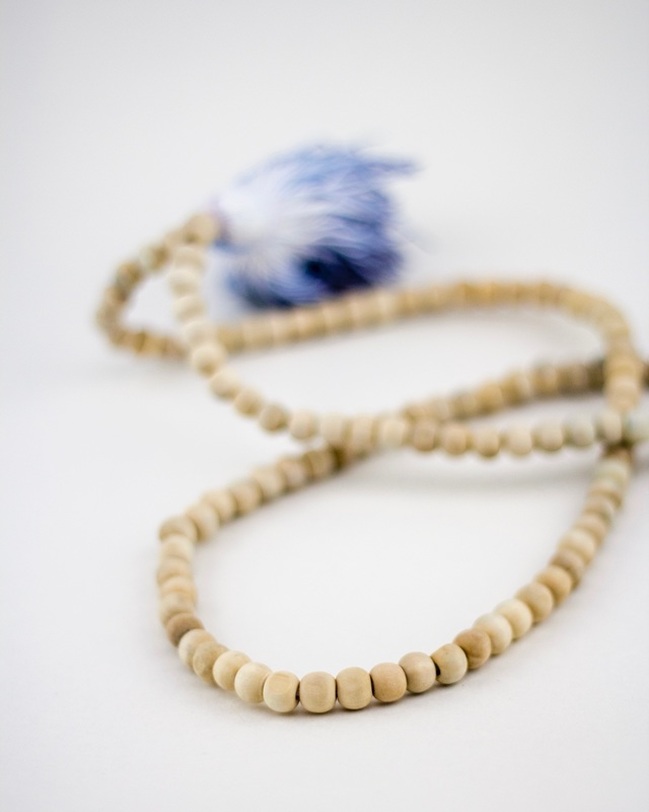 tie dye raw wood teething necklace in royal blue